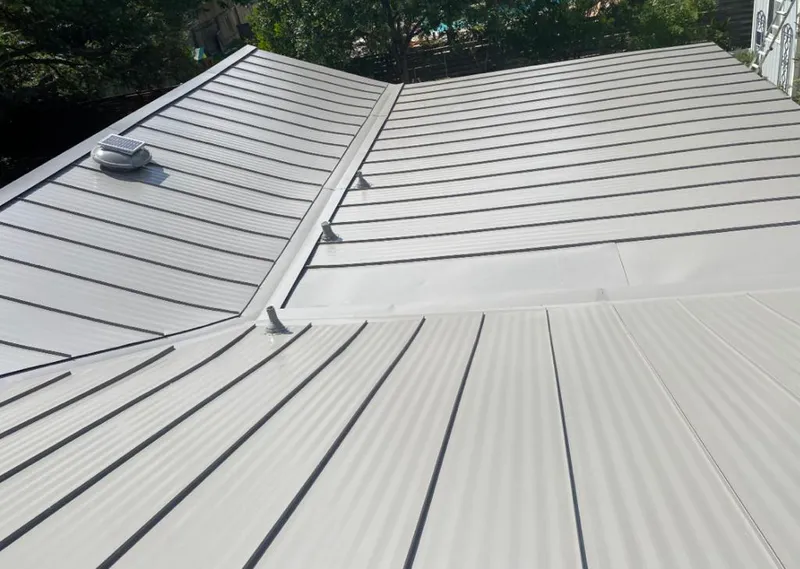 Solar attic fan installed on a metal roof for Roof Ventilation in West Orange